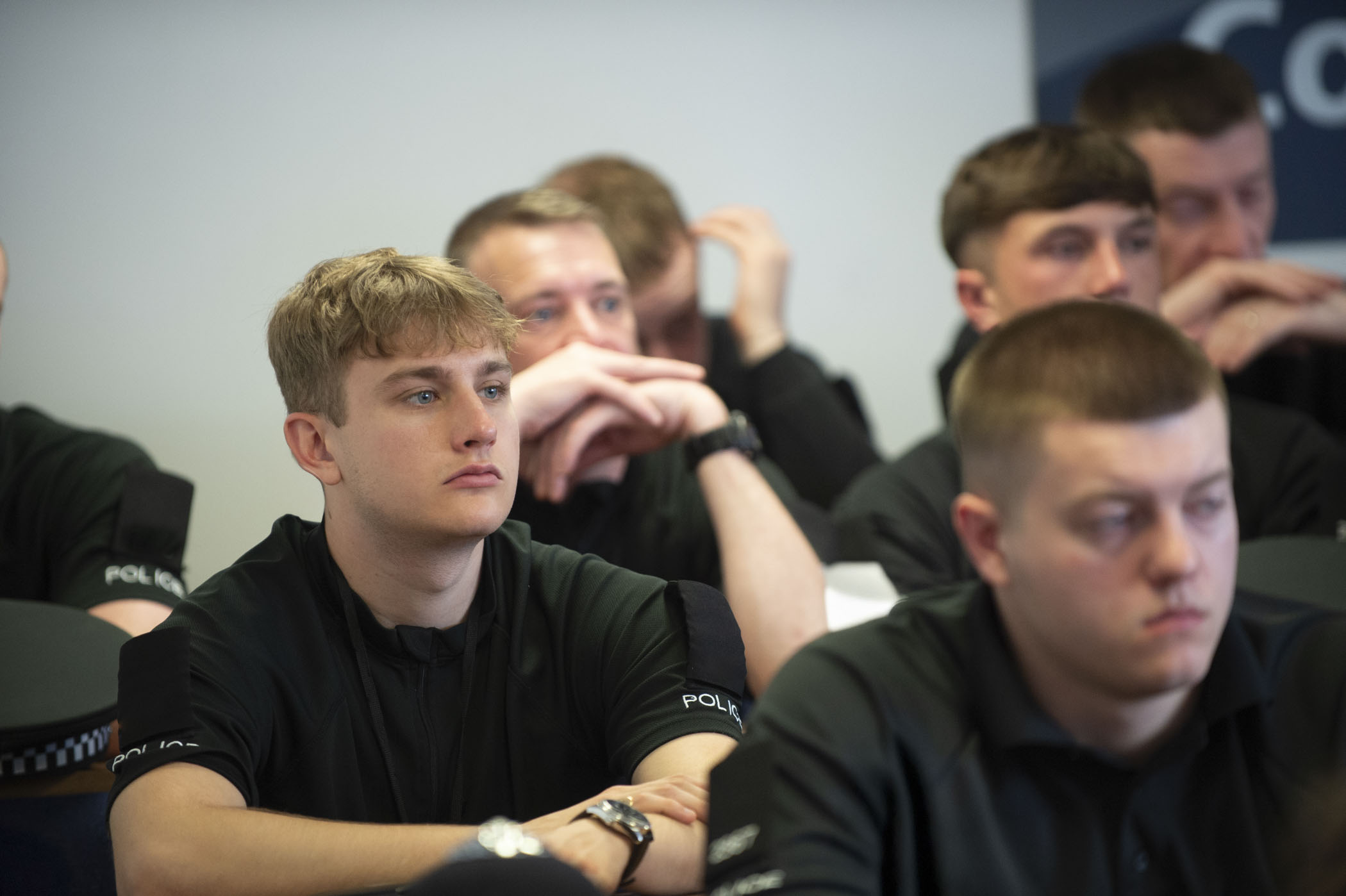 Two Ministry of Defence Police students in a classroom