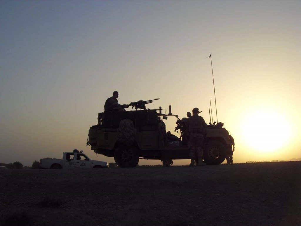 Military service personnel, with vehicle